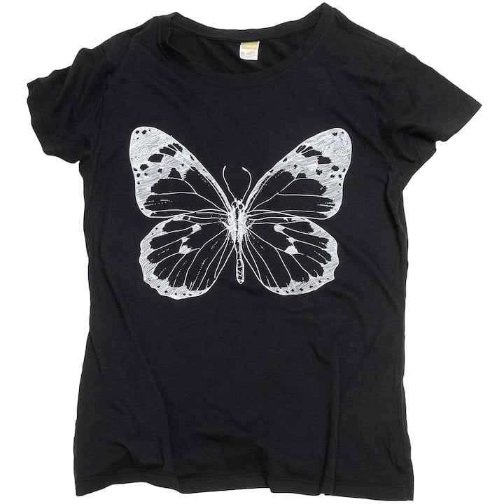 A black T-shirt featuring a large, white butterfly design printed on the front.