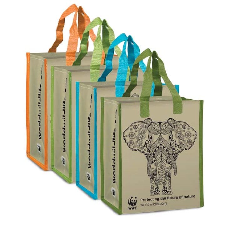 The image shows four reusable tote bags with colorful handles and an elephant design, branded with the WWF logo and message "Protecting the future of nature."