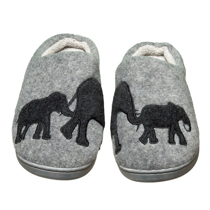 A gray pair of slippers with elephant silhouettes on them. Each slipper has 1/2 the silhouetee