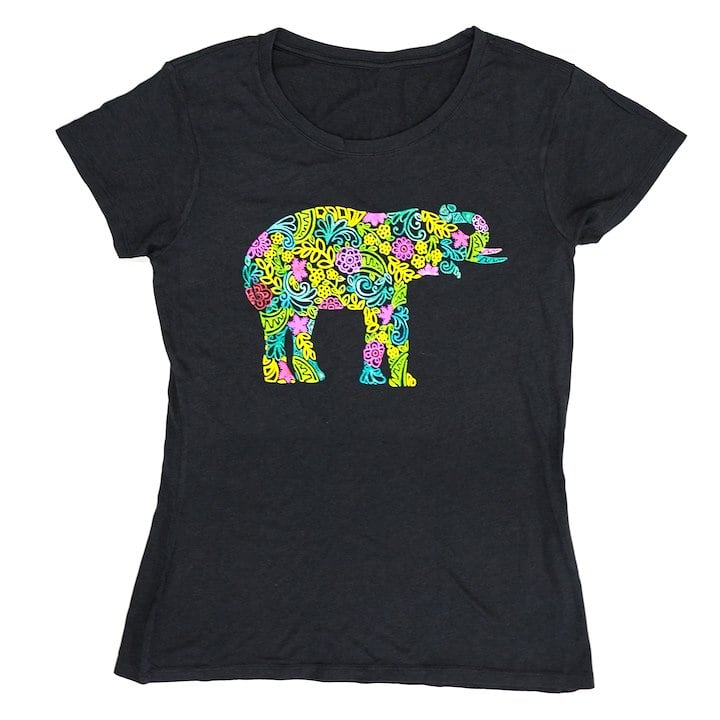 A black T-shirt features a colorful, decorative elephant design filled with intricate patterns.