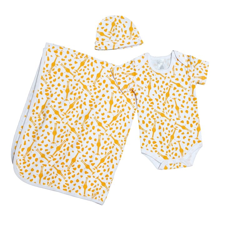 This image shows a baby set consisting of a blanket, a hat, and a onesie, all with a yellow and white spotted pattern.