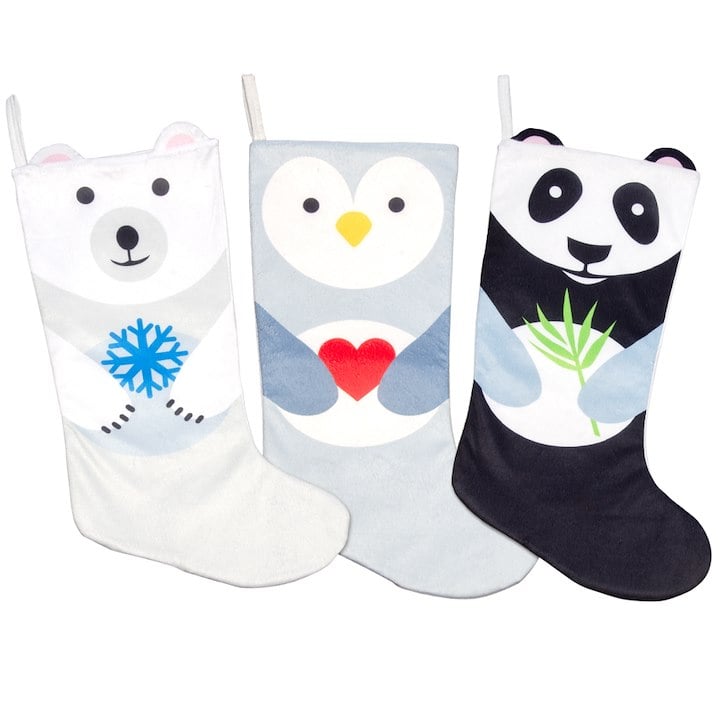 Three festive stockings featuring illustrated designs of a polar bear, penguin, and panda, each holding a themed object.