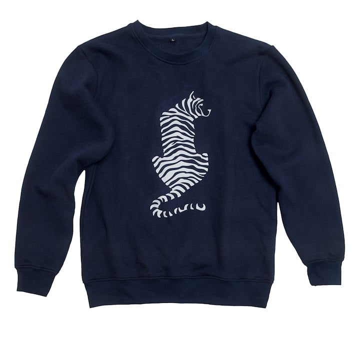 A blue sweatshirt with a white tiger design on it