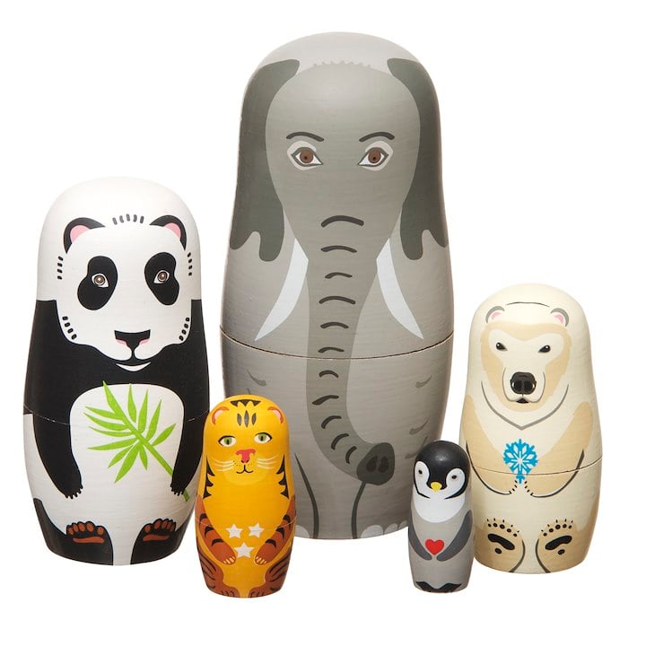 Animal-themed nesting dolls, including an elephant, panda, polar bear, tiger, and penguin, arranged in a group.