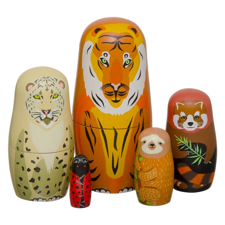 A set of animal-themed nesting dolls, featuring a tiger, a snow leopard, a red panda, a sloth, and a ladybug.