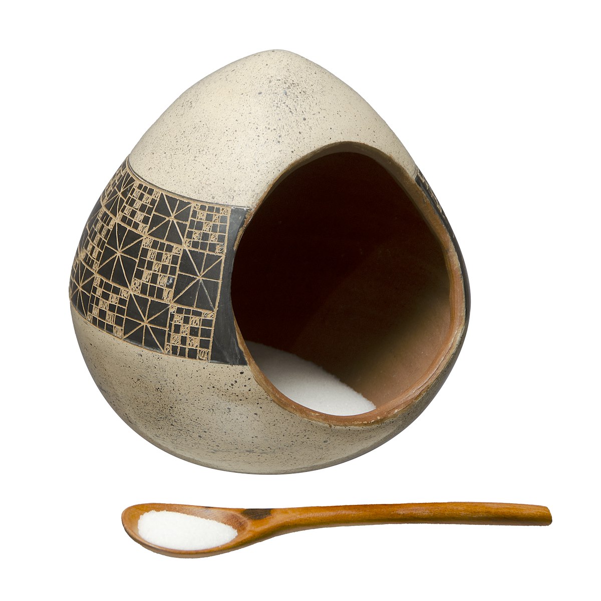 A handmade salt cellar with  spoon and salt