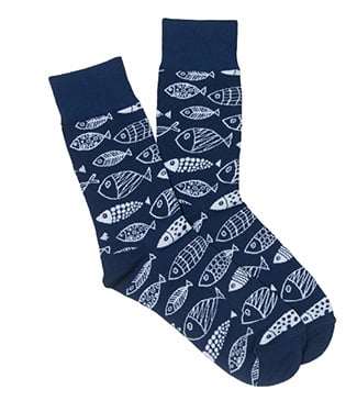 A pair of navy blue socks with a white fish pattern.