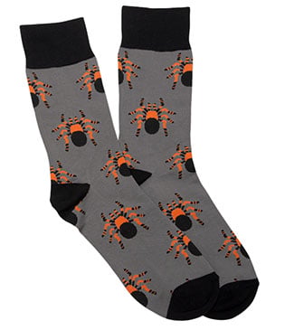 A pair of gray socks with black cuffs, toes, and heels, featuring an orange and black spider pattern.