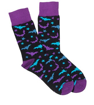 A pair of black socks with purple cuffs, heels, and toes, featuring a pattern of blue and purple bats and stars.