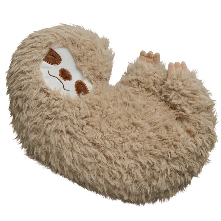 A stuffed sloth pillow with happy expression