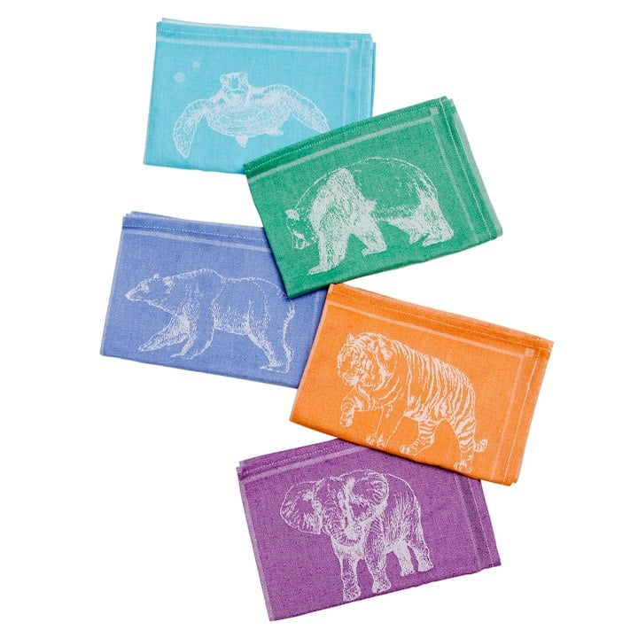 A group of colorful tea towels with animals on them