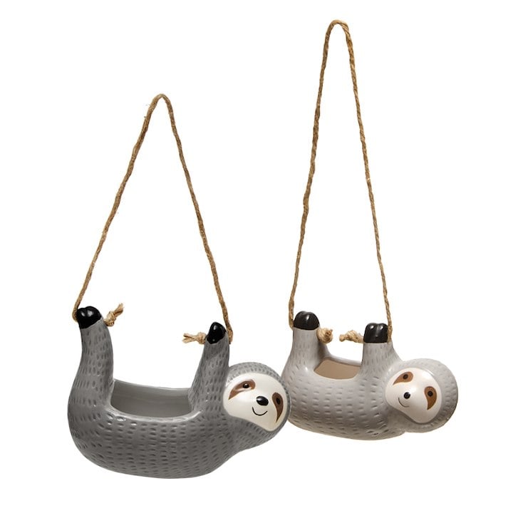 Two sloths planters hanging on a white background